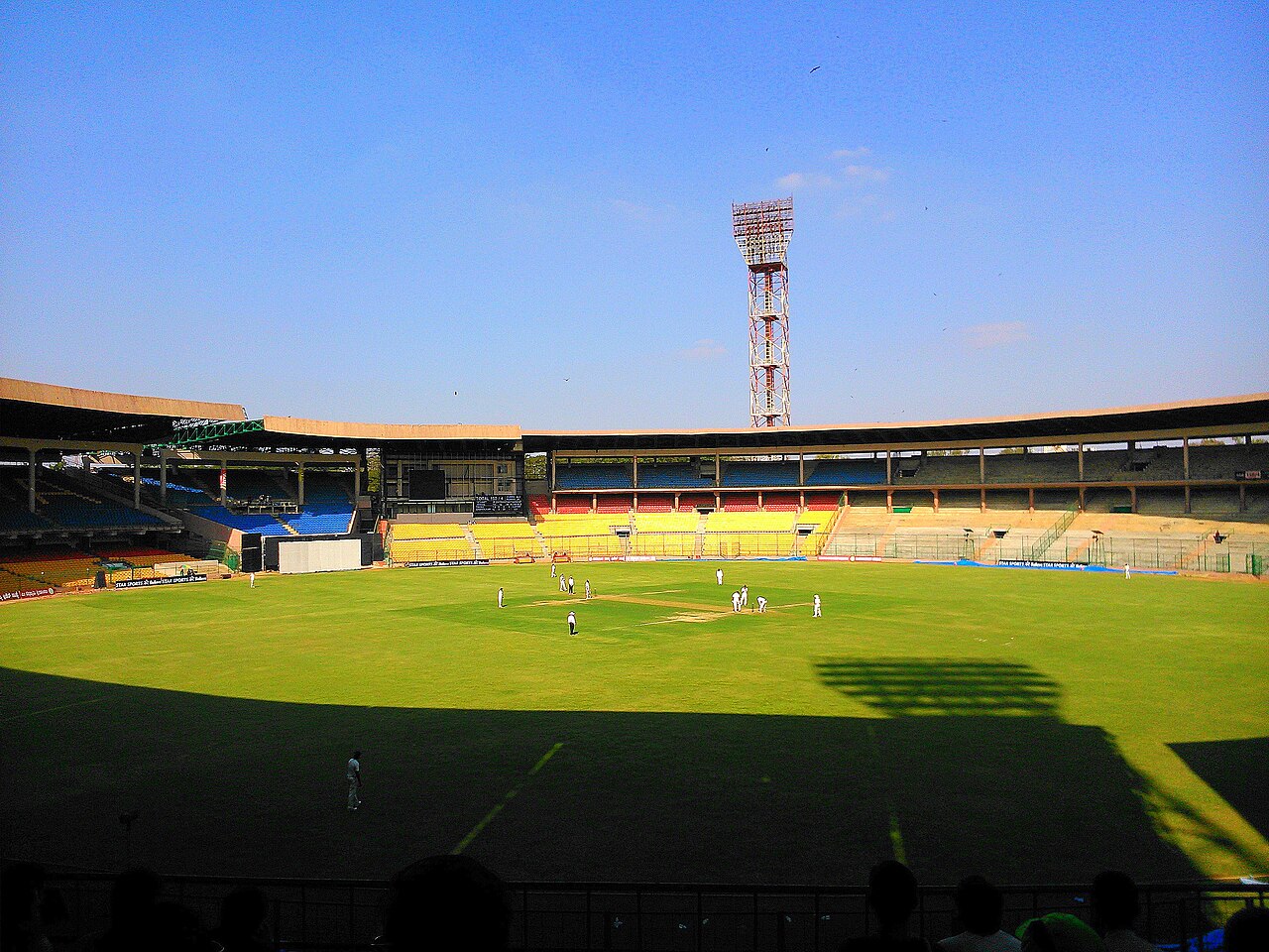 Cricket being played at M. Chinnaswamy Stadium in Bengaluru